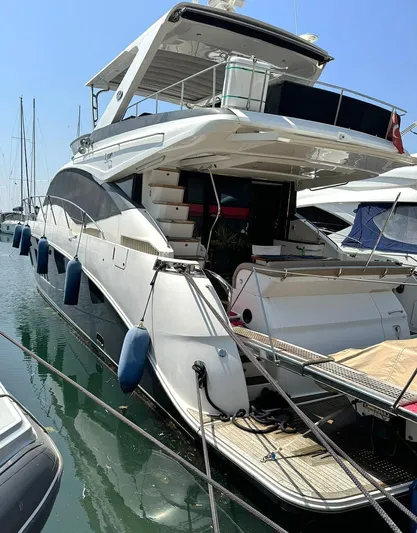  Yacht Photos Pics 2016 Sea Ray L650 Fly yacht docked in marina, featuring sleek design and spacious flybridge.