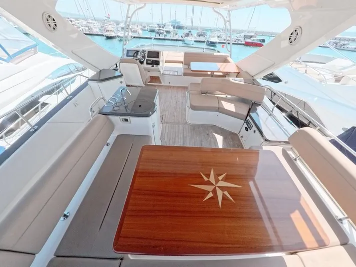  Yacht Photos Pics Luxurious 2016 Sea Ray L650 Fly yacht interior with elegant seating and wooden table.