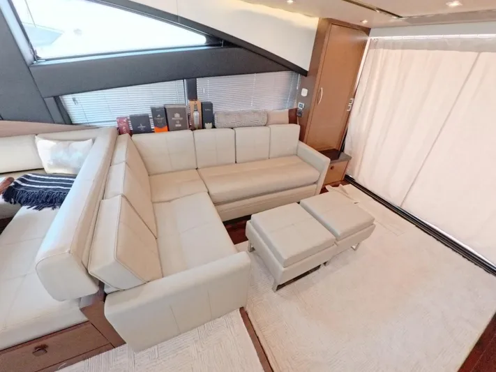  Yacht Photos Pics Luxurious interior of 2016 Sea Ray L650 Fly yacht with beige leather seating.
