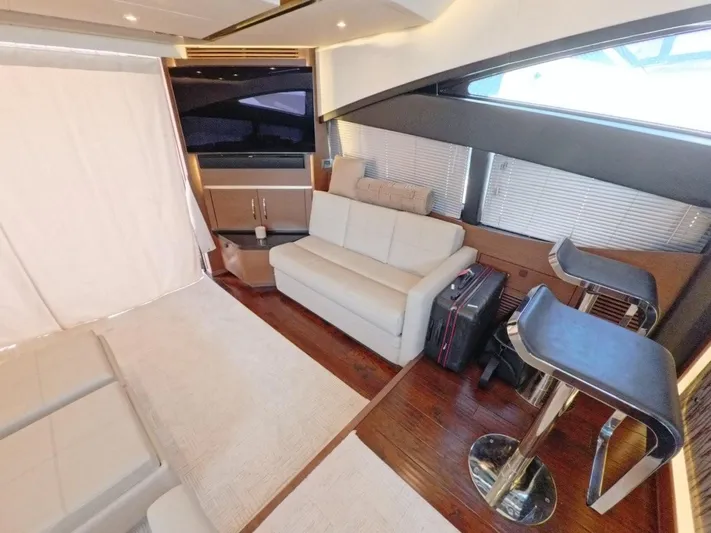  Yacht Photos Pics Luxurious interior of 2016 Sea Ray L650 Fly yacht with modern seating and elegant design.