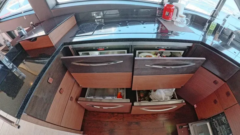  Yacht Photos Pics Luxurious 2016 Sea Ray L650 Fly yacht kitchen with modern appliances and sleek cabinetry.