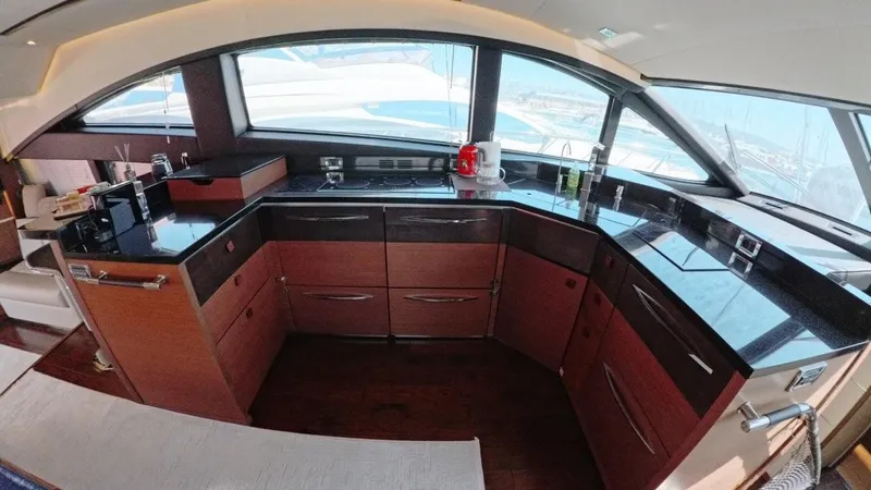  Yacht Photos Pics Luxurious kitchen interior of 2016 Sea Ray L650 Fly yacht with modern appliances.