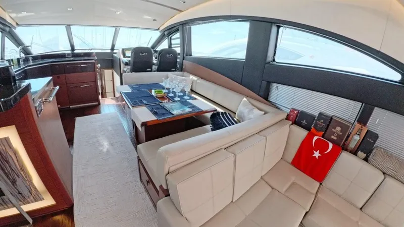  Yacht Photos Pics Luxurious interior of 2016 Sea Ray L650 Fly yacht with elegant seating and dining area.