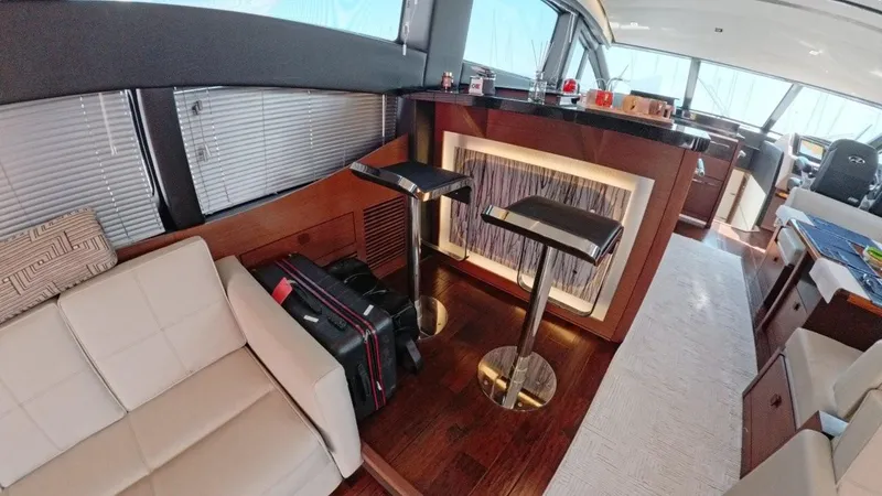  Yacht Photos Pics Luxurious interior of 2016 Sea Ray L650 Fly yacht with bar and seating area.