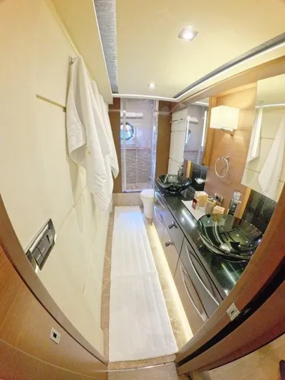  Yacht Photos Pics Luxurious bathroom interior of 2016 Sea Ray L650 Fly yacht with modern fixtures and elegant design.