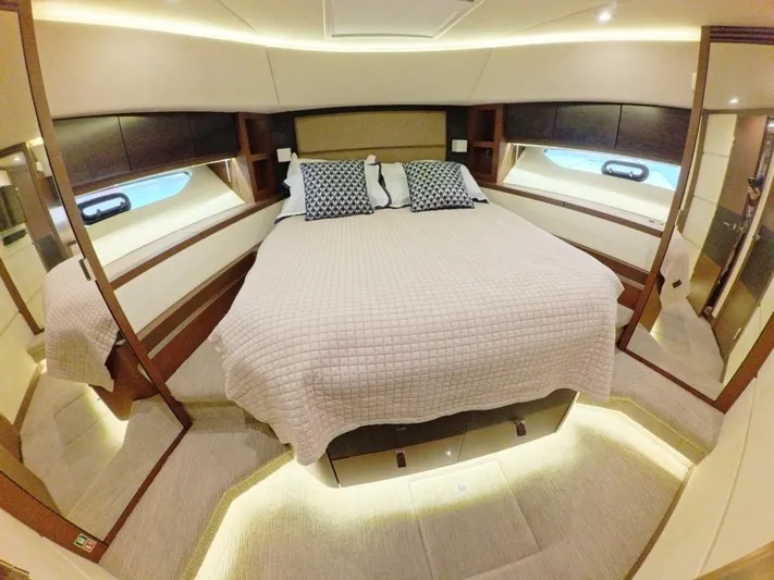  Yacht Photos Pics Luxurious bedroom interior of 2016 Sea Ray L650 Fly yacht with elegant bedding.