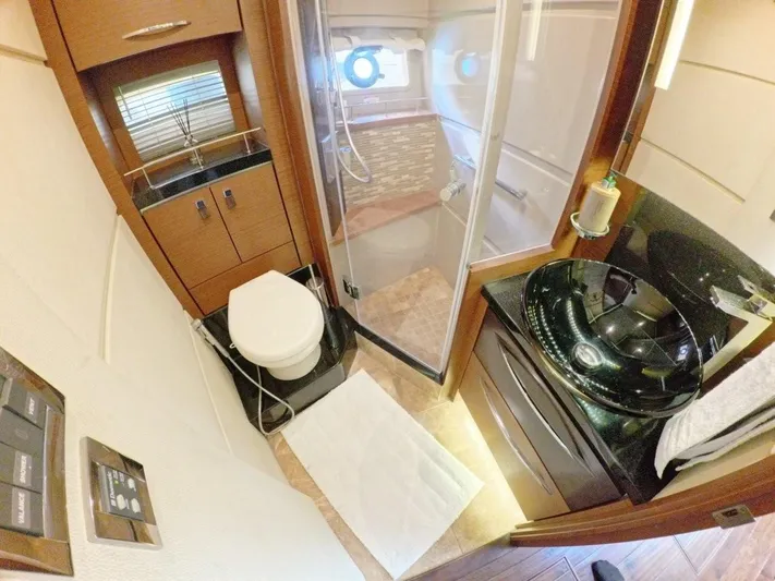 Yacht Photos Pics Luxurious bathroom in 2016 Sea Ray L650 Fly yacht with modern fixtures and elegant design.
