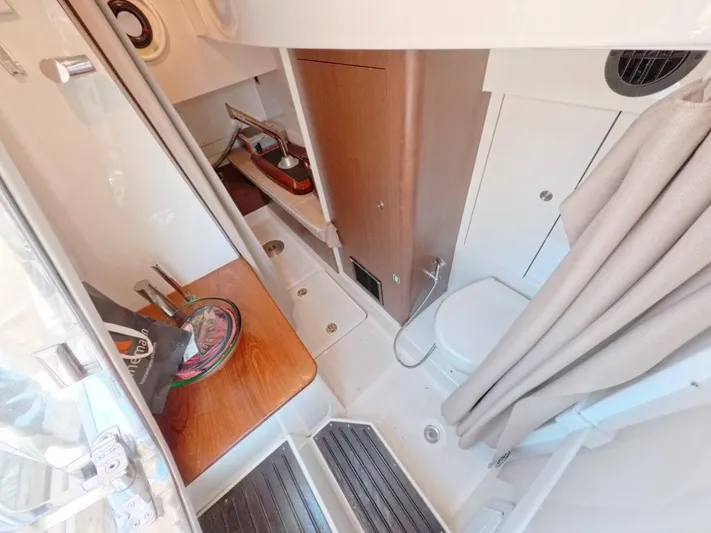  Yacht Photos Pics 2016 Sea Ray L650 Fly yacht bathroom with modern amenities and wooden accents.