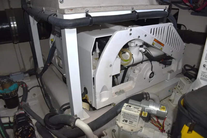  Yacht Photos Pics Engine room of 2016 Sea Ray L650 Fly yacht, showcasing mechanical components and wiring.