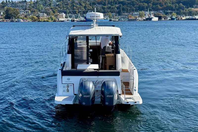Shanty Town Yacht Photos Pics 2020 Jeanneau NC 895 boat on water with twin engines, scenic background.