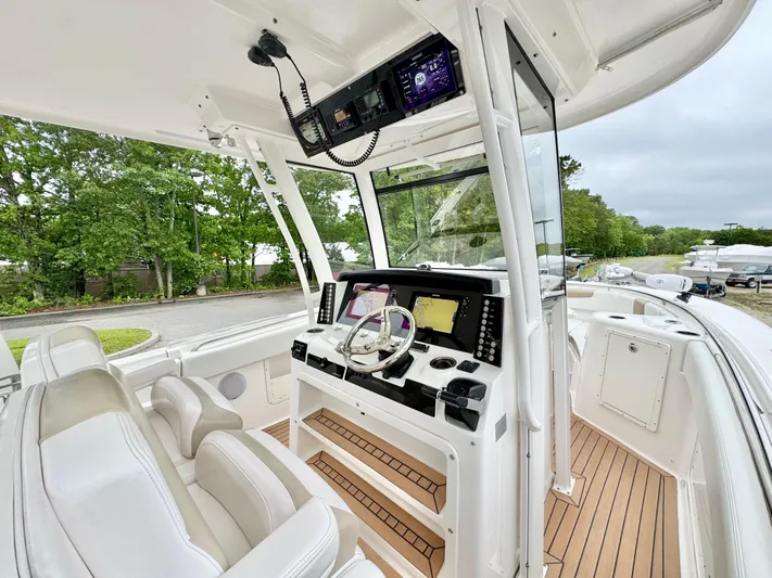  Yacht Photos Pics 2018 Robalo R302 Center Console boat interior with modern helm and seating.