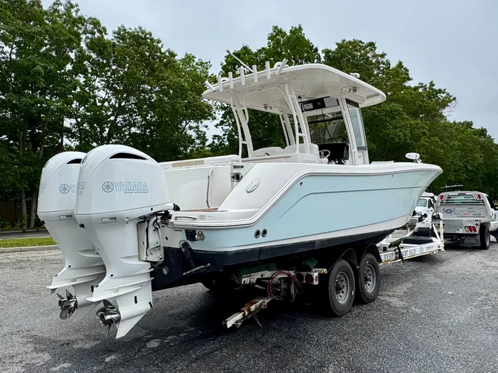  Yacht Photos Pics 2018 Robalo R302 Center Console boat on trailer with twin Yamaha engines.