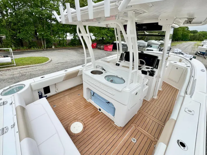  Yacht Photos Pics 2018 Robalo R302 Center Console boat with teak flooring and modern helm station.