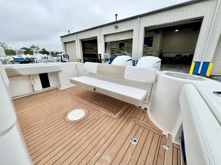  Yacht Photos Pics 2018 Robalo R302 Center Console boat with teak deck and foldable seating.
