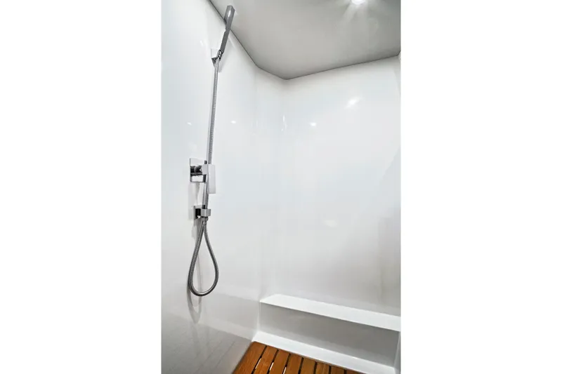 One Love Yacht Photos Pics Modern shower area in 2019 Fjord 52 Open yacht with sleek fixtures and wooden flooring.