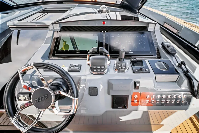 One Love Yacht Photos Pics Helm of 2019 Fjord 52 Open yacht with advanced navigation controls and displays.