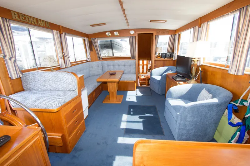 Redhawk Yacht Photos Pics Interior of 1996 Grand Banks 46 Classic yacht with cozy seating and wooden furnishings.