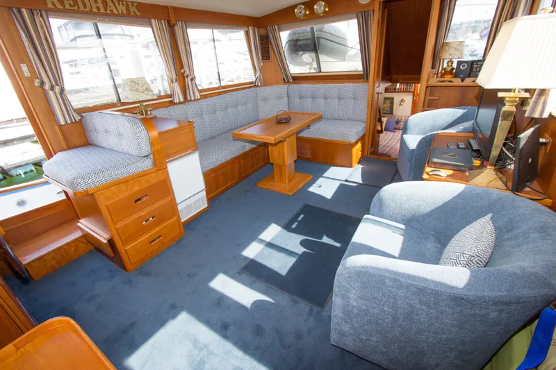Redhawk Yacht Photos Pics Luxurious 1996 Grand Banks 46 Classic yacht interior with plush seating and elegant wood finishes.