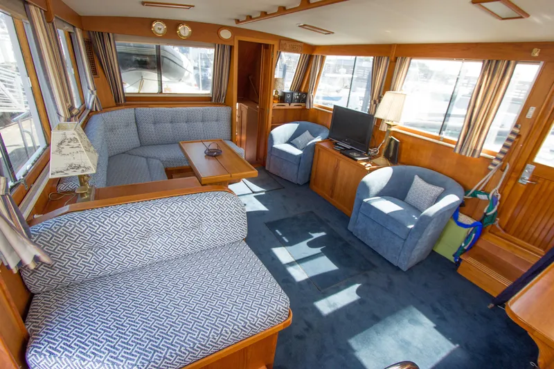 Redhawk Yacht Photos Pics Interior of 1996 Grand Banks 46 Classic yacht with cozy seating and nautical decor.