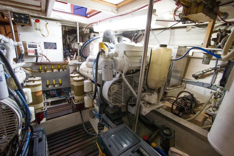 Redhawk Yacht Photos Pics Engine room of a 1996 Grand Banks 46 Classic yacht, showcasing machinery and equipment.