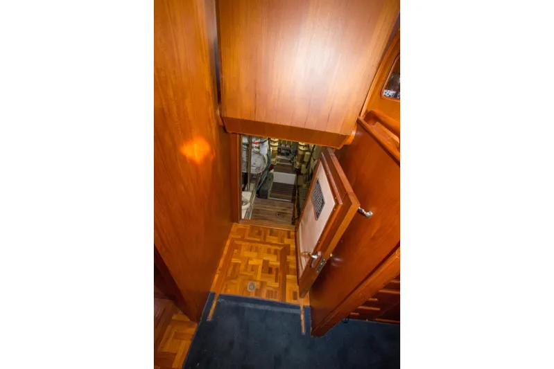 Redhawk Yacht Photos Pics Interior view of 1996 Grand Banks 46 Classic yacht with wooden flooring and cabinetry.
