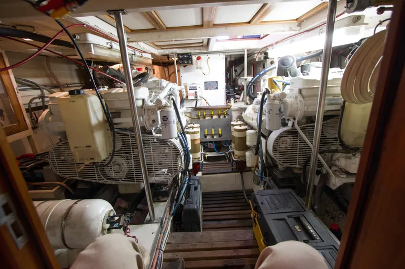 Redhawk Yacht Photos Pics Engine room of a 1996 Grand Banks 46 Classic yacht, showcasing mechanical components.