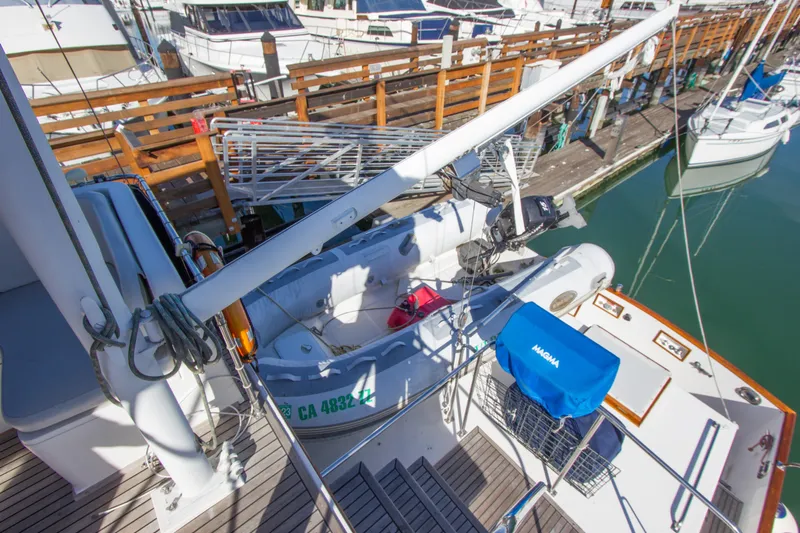 Redhawk Yacht Photos Pics 1996 Grand Banks 46 Classic yacht docked with dinghy and equipment on deck.