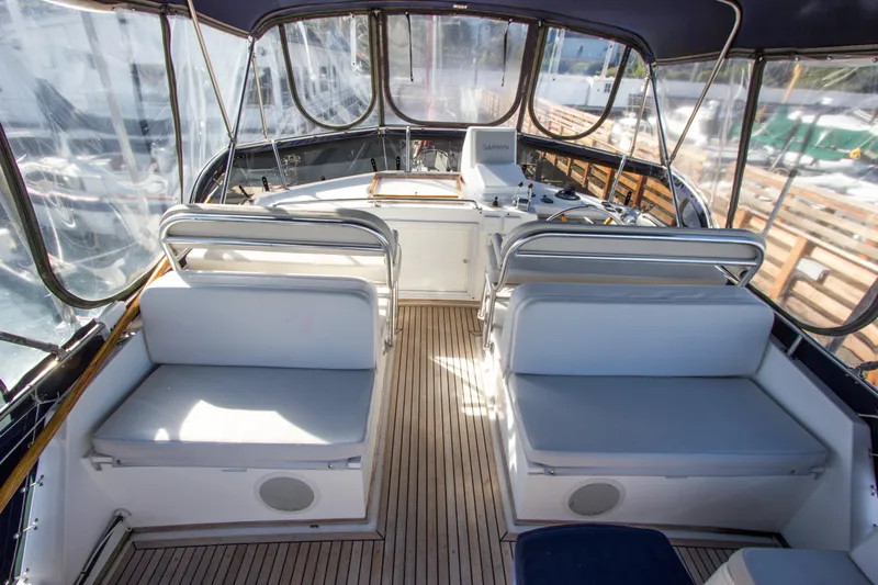 Redhawk Yacht Photos Pics Flybridge of 1996 Grand Banks 46 Classic yacht with seating and navigation equipment.