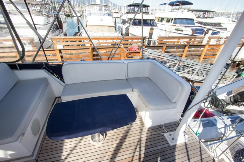Redhawk Yacht Photos Pics 1996 Grand Banks 46 Classic yacht with spacious deck seating at a marina.