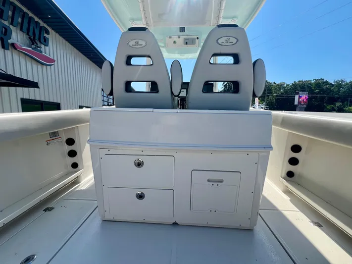  Yacht Photos Pics 2023 Sailfish 290 CC boat interior with dual seats and storage compartments.