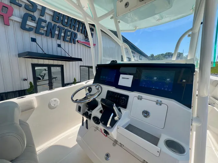  Yacht Photos Pics 2023 Sailfish 290 CC boat dashboard with modern controls and navigation screens.