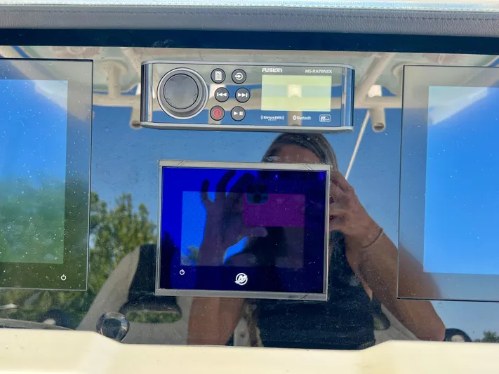  Yacht Photos Pics Dashboard of 2023 Sailfish 290 CC boat with electronic controls and display screens.