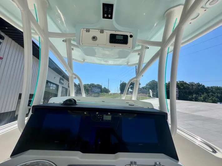  Yacht Photos Pics 2023 Sailfish 290 CC boat interior with modern dashboard and overhead console.