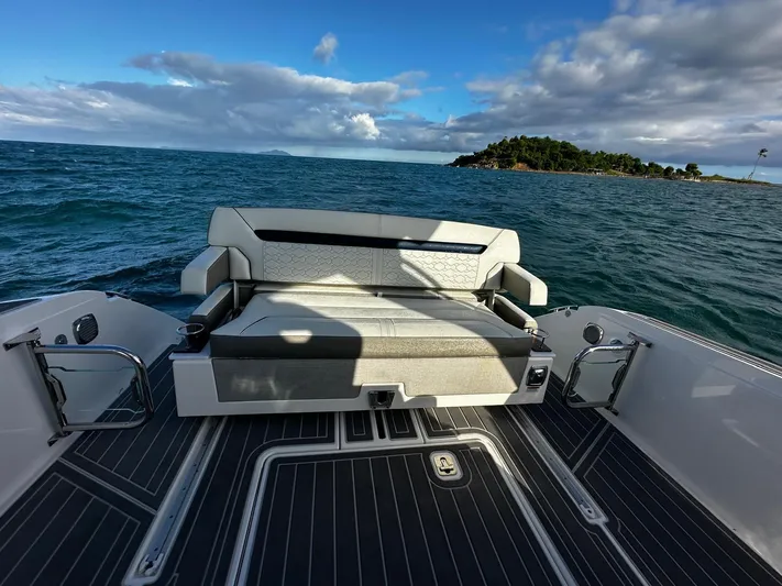  Yacht Photos Pics 2023 Tiara Yachts 34 LS boat with seating, ocean view, and distant island.