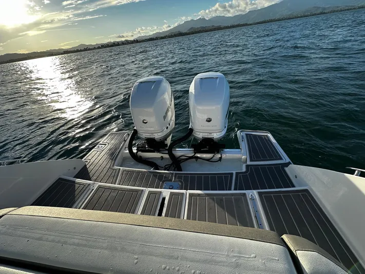  Yacht Photos Pics 2023 Tiara Yachts 34 LS with dual engines on open water at sunset.