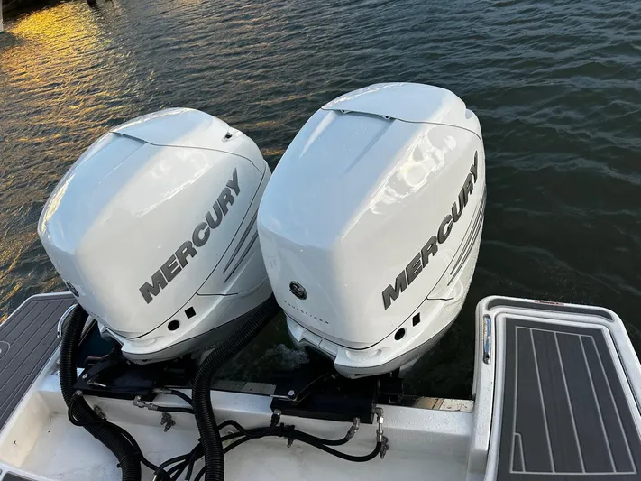  Yacht Photos Pics 2023 Tiara Yachts 34 LS with dual Mercury outboard engines on water.