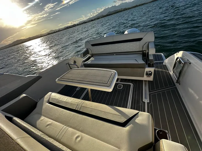  Yacht Photos Pics 2023 Tiara Yachts 34 LS luxury boat interior with sunset view over water.