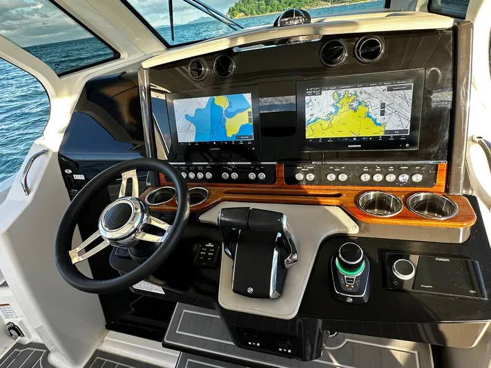  Yacht Photos Pics 2023 Tiara Yachts 34 LS helm with dual navigation screens and modern controls.