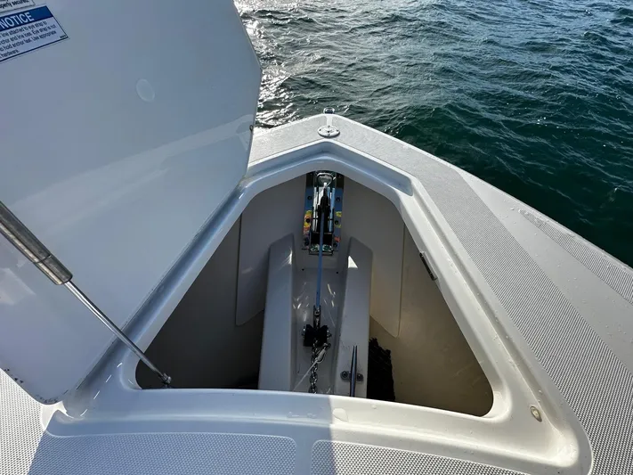  Yacht Photos Pics 2023 Tiara Yachts 34 LS anchor compartment open on calm water.
