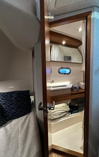  Yacht Photos Pics 2023 Tiara Yachts 34 LS interior cabin with modern bathroom and cozy sleeping area.