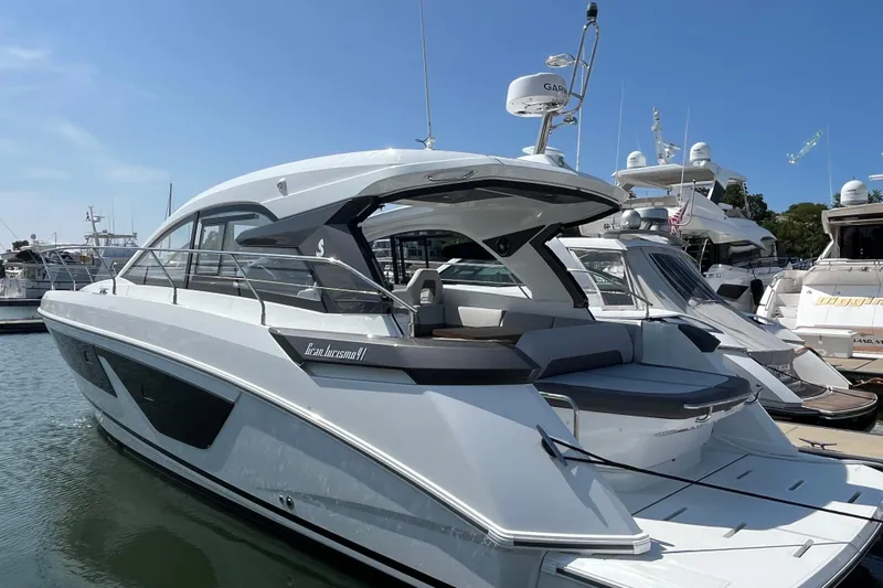  Yacht Photos Pics 2026 Beneteau Gran Turismo 41 yacht docked at marina under clear blue sky.