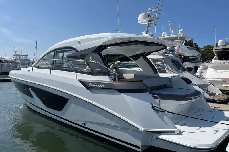  Yacht Photos Pics 2026 Beneteau Gran Turismo 41 yacht docked at marina under clear blue sky.