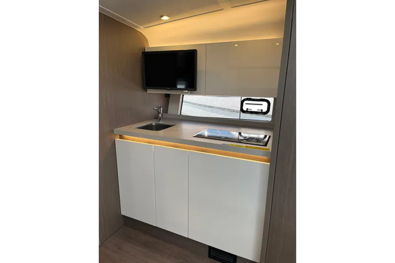  Yacht Photos Pics Modern kitchen area in 2026 Beneteau Gran Turismo 41 yacht with sleek cabinetry and appliances.