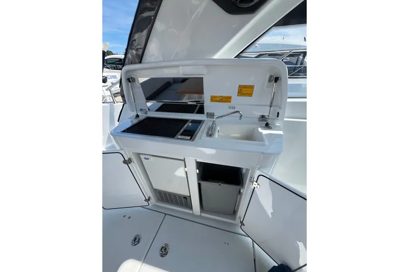  Yacht Photos Pics 2026 Beneteau Gran Turismo 41 yacht kitchenette with sink and grill.