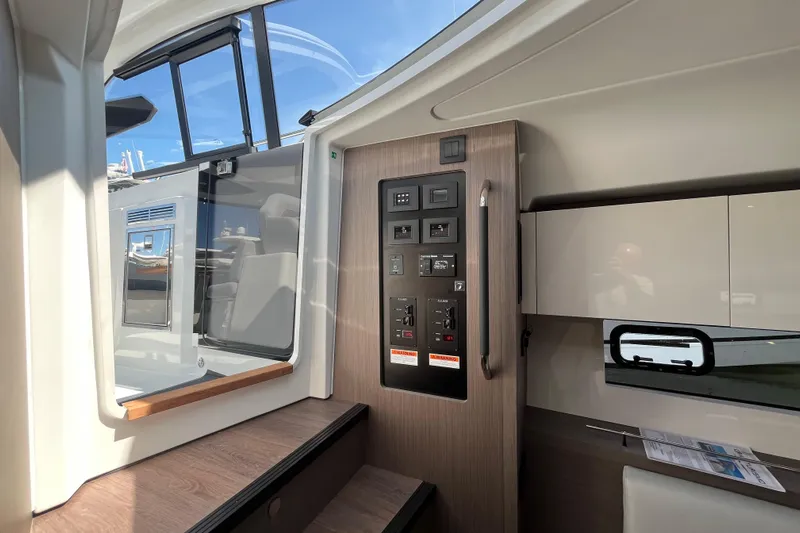  Yacht Photos Pics Interior view of 2026 Beneteau Gran Turismo 41 yacht, featuring control panel and modern design.