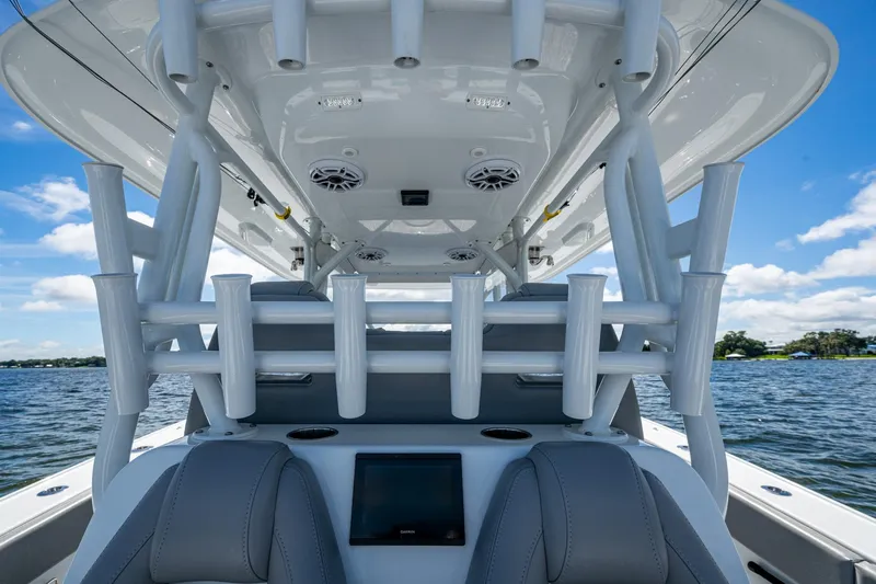  Yacht Photos Pics 2022 Freeman 34VH boat interior with rod holders and seating on a sunny day.