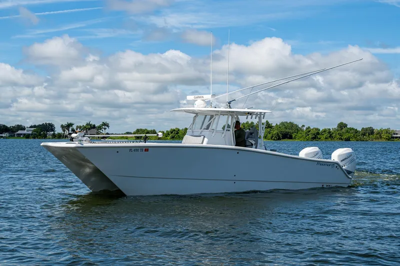  Yacht Photos Pics 2022 Freeman 34VH boat cruising on a sunny day with clear skies.