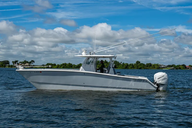  Yacht Photos Pics 2022 Freeman 34VH boat cruising on a sunny day with blue skies and calm waters.