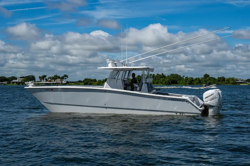  Yacht Photos Pics 2022 Freeman 34VH boat on a lake under a cloudy sky.