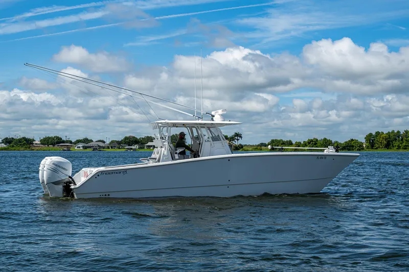  Yacht Photos Pics 2022 Freeman 34VH boat cruising on a sunny day with clear skies.